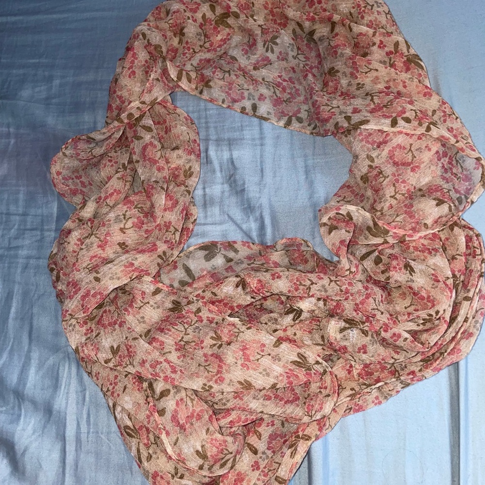 It’s a floral sheer scarf.